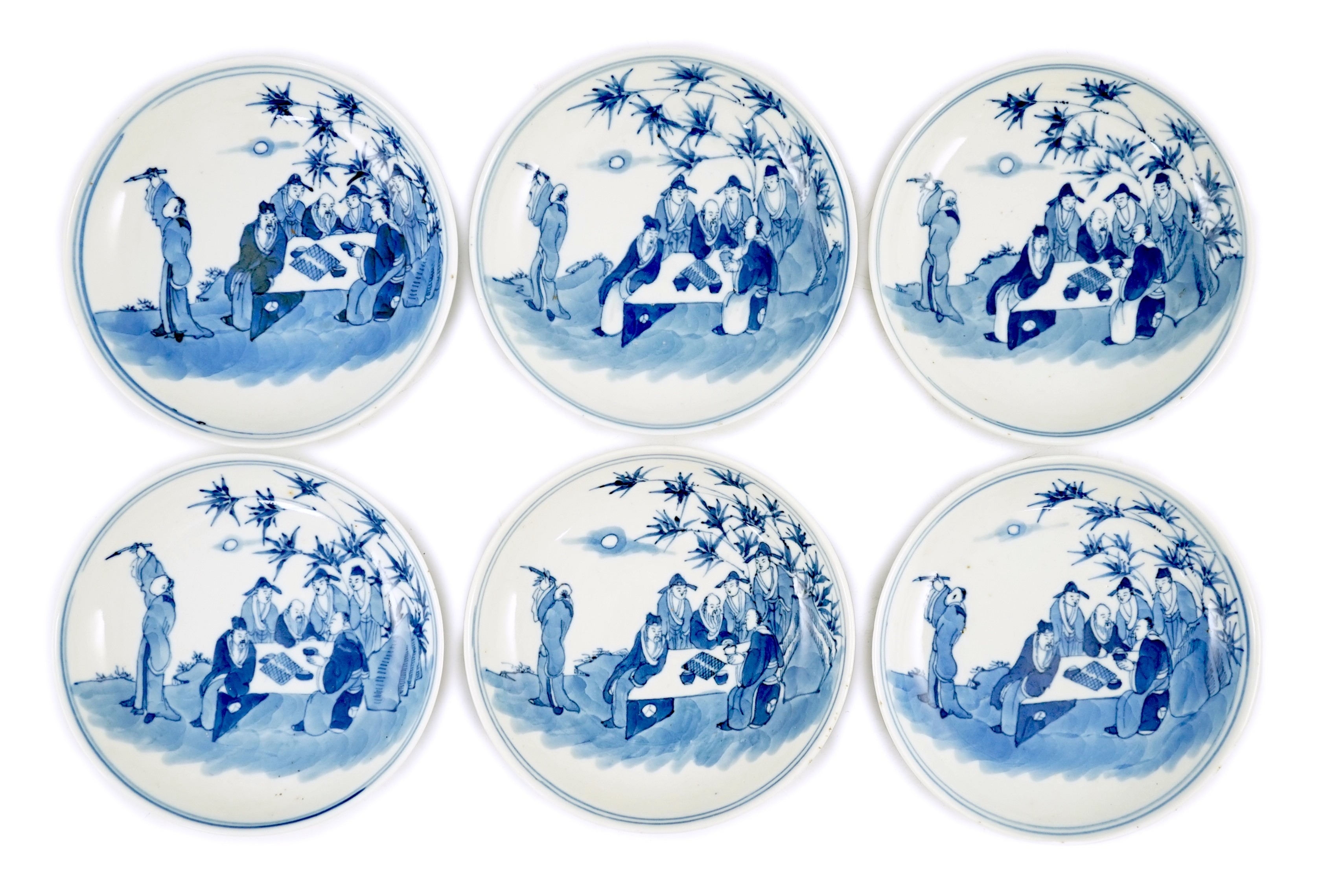 A set of six Chinese ‘Seven Sages of the Bamboo Grove’ saucer dishes, Kangxi marks but late 19th century, 12.3cm diameter